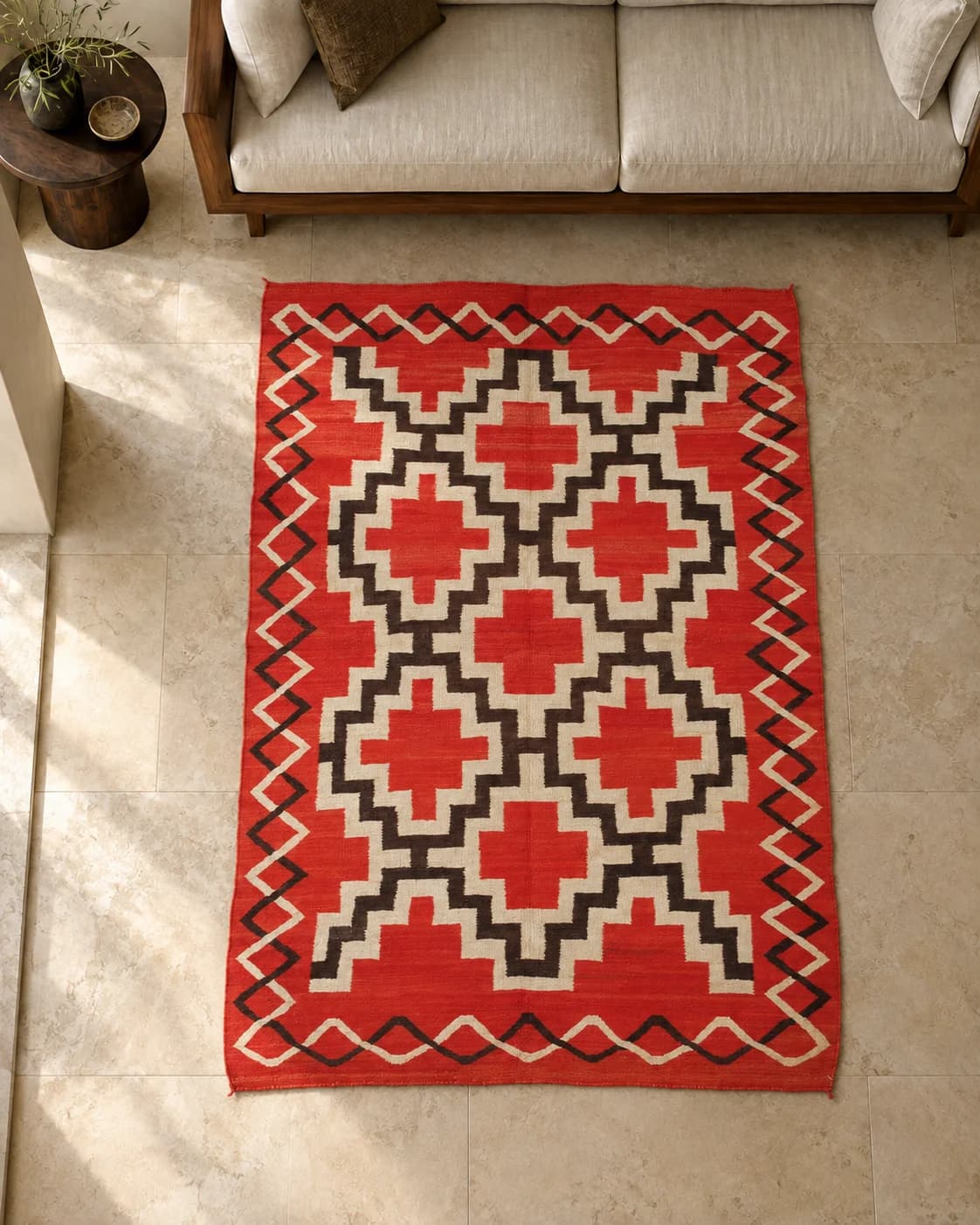 Editorial room interpretation of Red Geometry beside a cream sofa